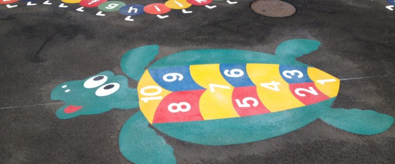 Painted turtle with numbers in playground